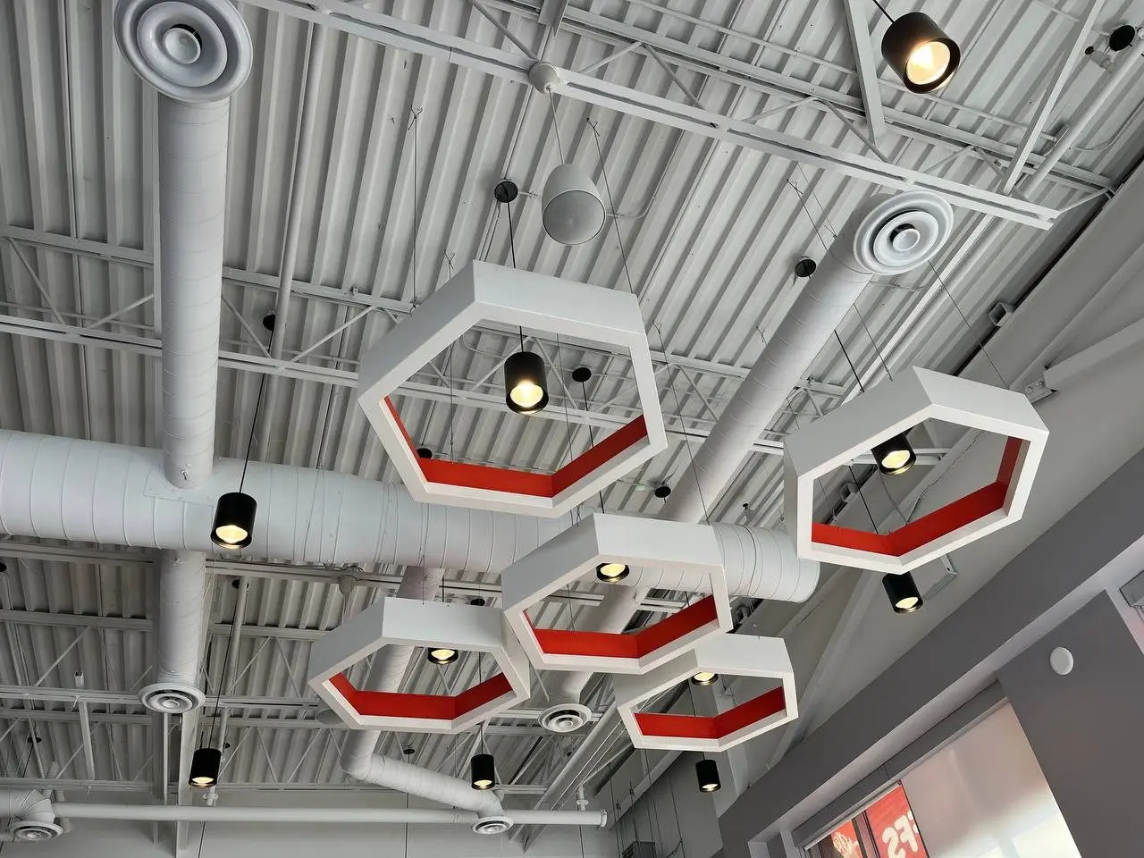 Mr. Puffs café in Vaughan: exposed ductwork and hexagon feature lighting, mechanical design by Home Fresh Air